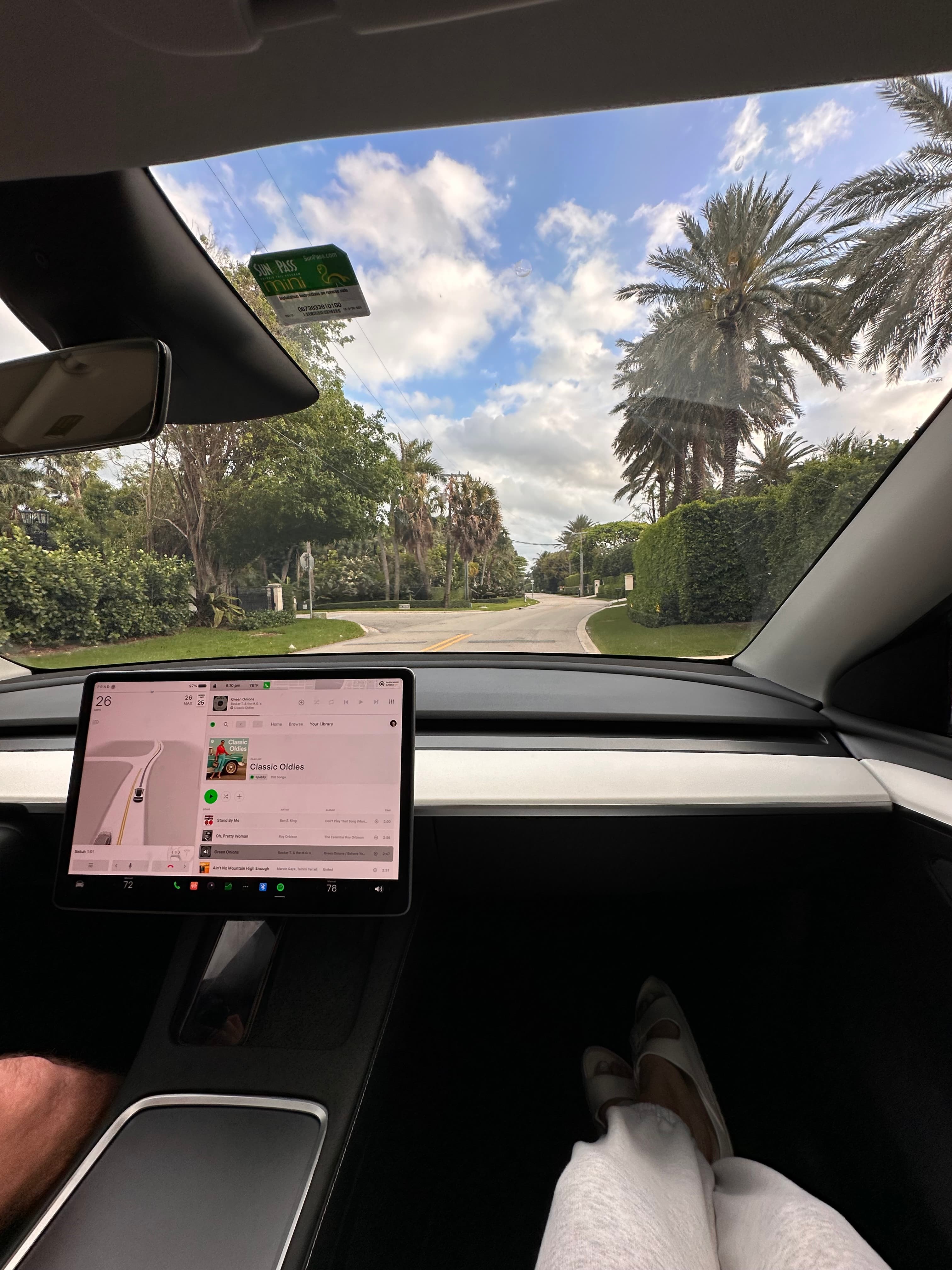 Tesla Model Y driving home in palm beach